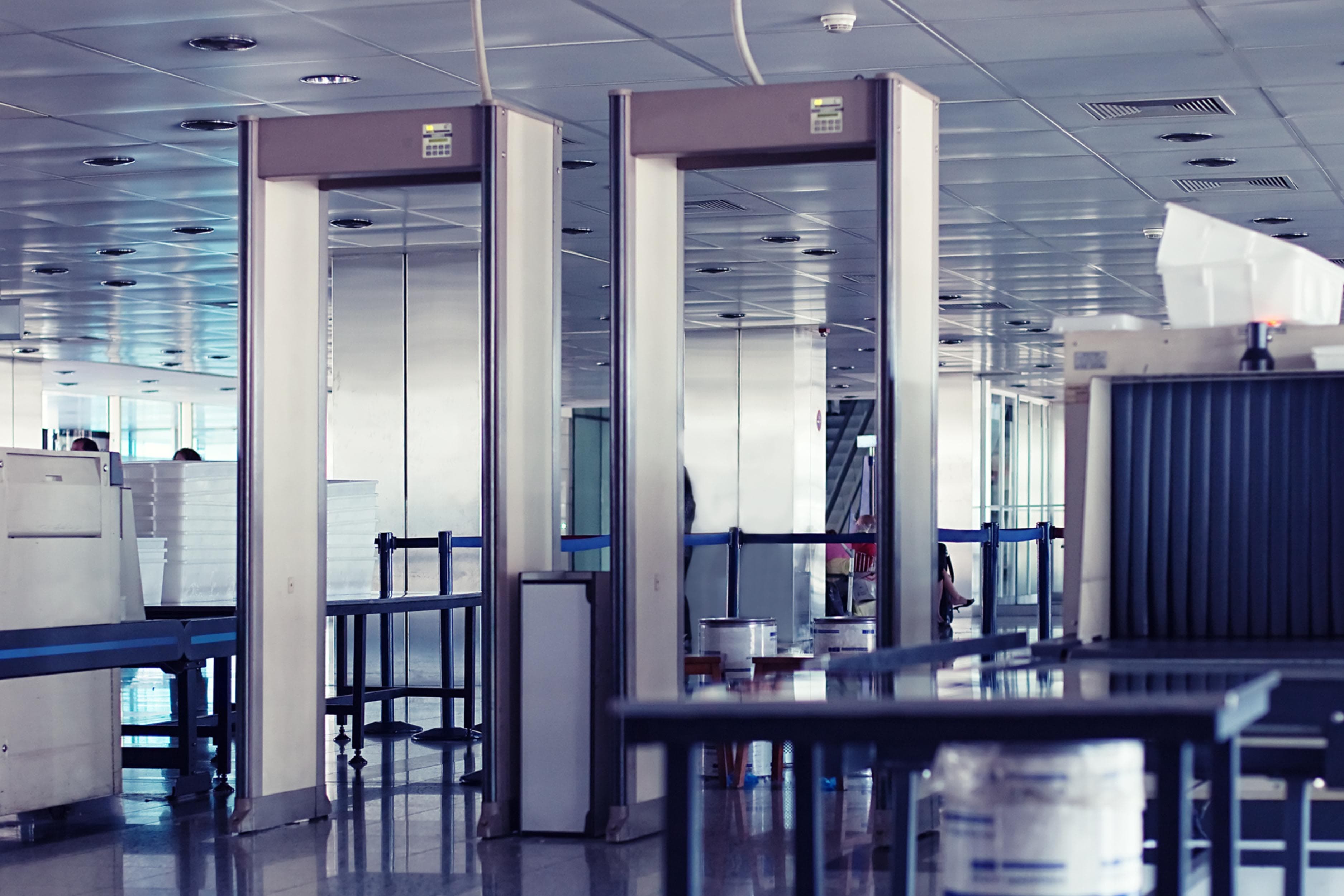 Two door frame metal detectors at a security screening checkpoint